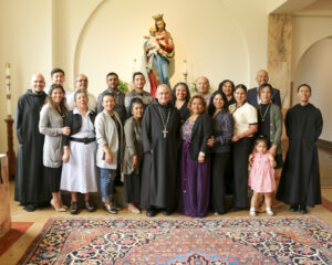 Abbot Jeremy, with Br. Ignatius (far left) and Fr. John Paul (far right), with the new oblates and their families