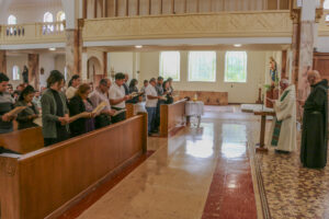 Abbot Jeremy receives the oblation of new Hispanic oblates of Mount Angel Abbey. Br. Ignatius (right) is the director of the Hispanic oblate program