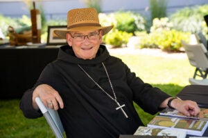 Abbot Jeremy, signing books at the Saint Benedict Festival 2024