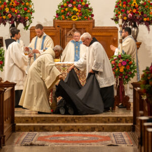 Br Isaiah Solemn Vows lying prostrate before the altar